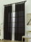 Závěsy s poutky 140 × 250 cm – Oscar černé (2 ks)